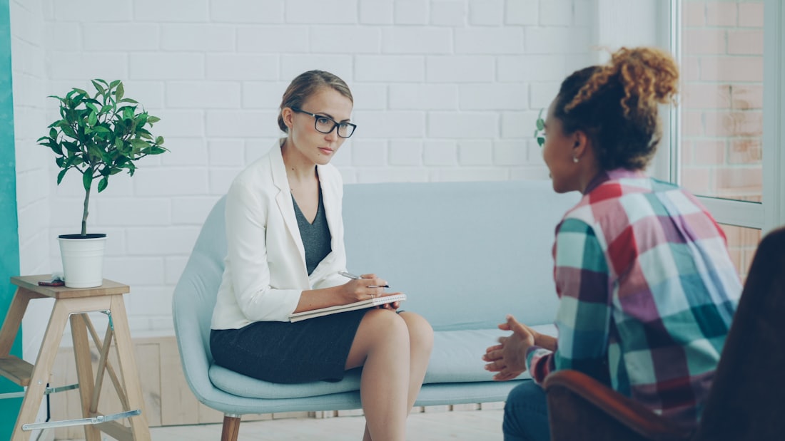 An oral wellness coach reviewing a personalized plan with a guest