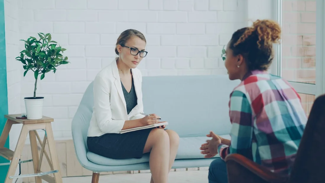 An oral wellness coach reviewing a personalized plan with a guest