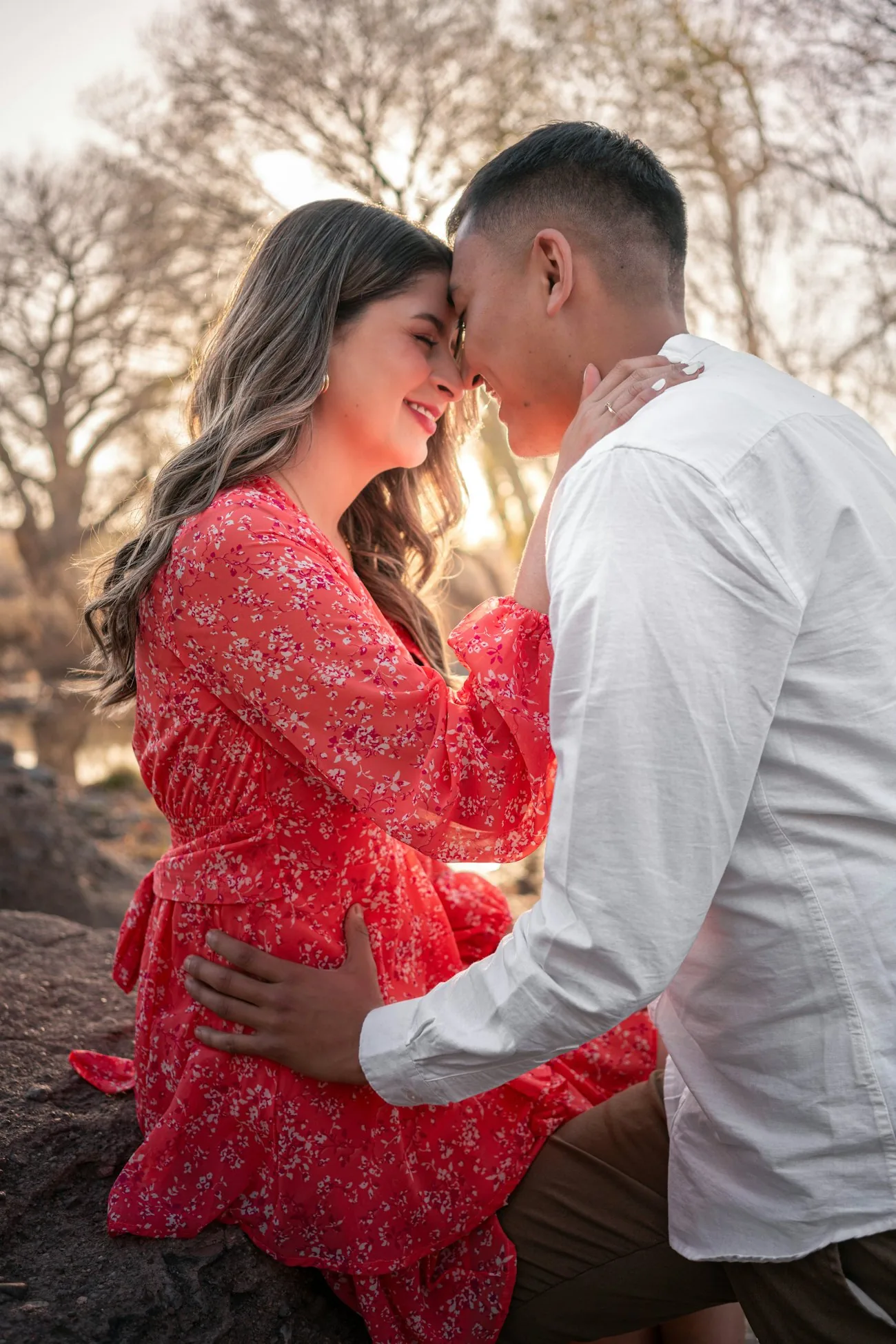 An expecting couple sharing a tender moment